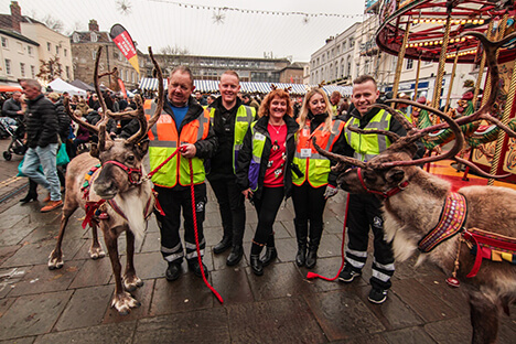 A group of CJ's Events works with reindeer