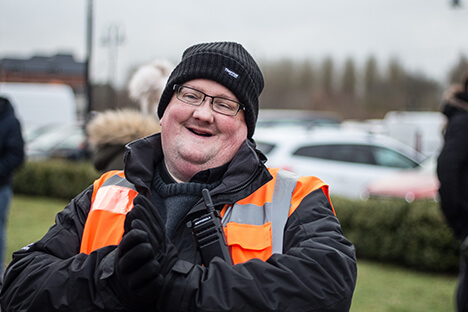 A smiling CJ's Events Worker